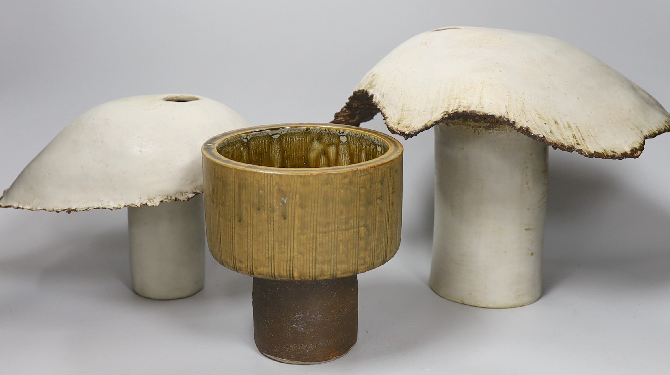 Ruth Sulke - two studio glazed stoneware ‘mushroom’ vases, together with a small studio pottery jardiniere, tallest 21cm